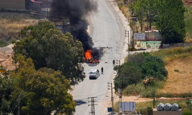First responders attend to a burning vehicle targeted by an Israeli drone attack in the southern Lebanese city of Nabatieh on June 5, 2026. &mdash;AFP
