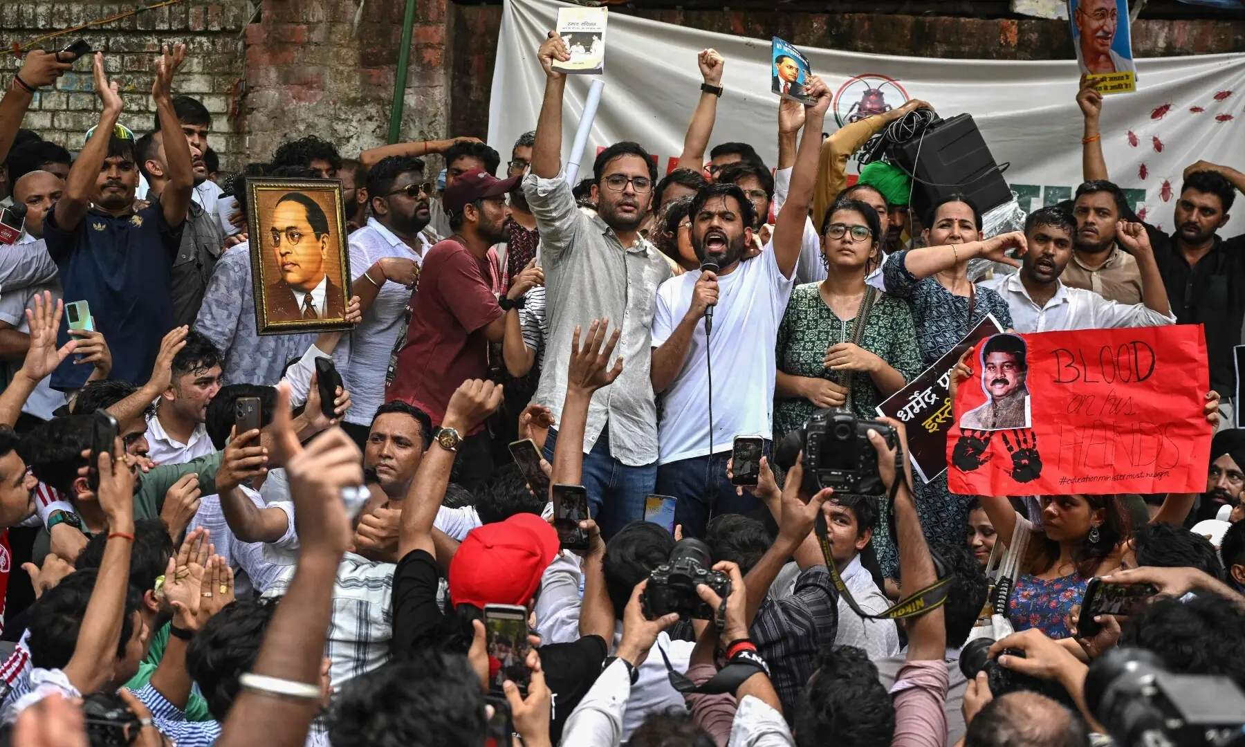 Cockroach Janta Party (CJP) founder Abhijeet Dipke (C, right) shouts slogans during a protest over alleged irregularities in the country’s major examinations, in New Delhi on June 6, 2026. —AFP