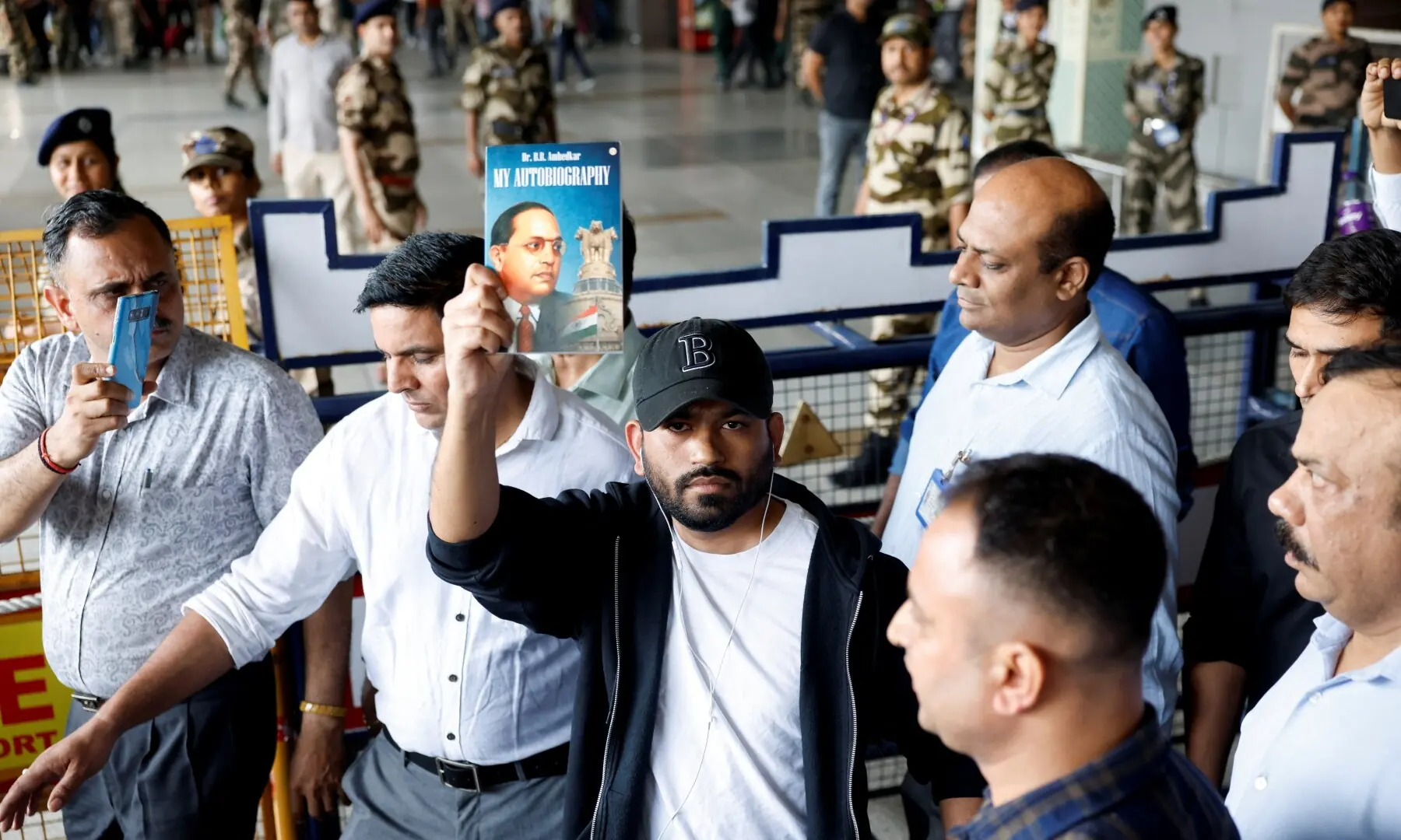 Abhijeet Dipke, head of the Cockroach Janta Party (CJP), holds a copy of “My Autobiography” by Dr. B. R. Ambedkar upon his arrival at an airport in New Delhi, India, June 6, 2026. —Reuters