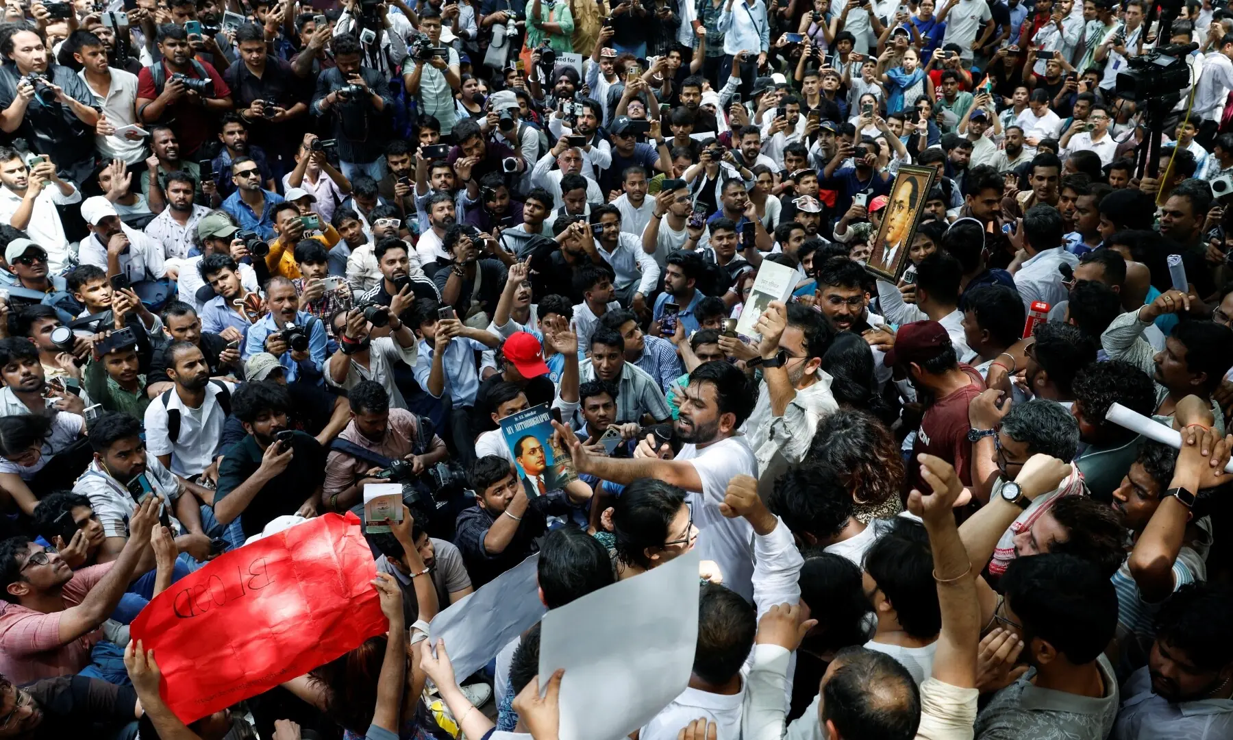 Abhijeet Dipke, head of the Cockroach Janta Party (CJP), speaks to supporters of the CJP during a sit-in protest demanding the resignation of Indian Education Minister Dharmendra Pradhan, in New Delhi, India on June 6, 2026. —Reuters