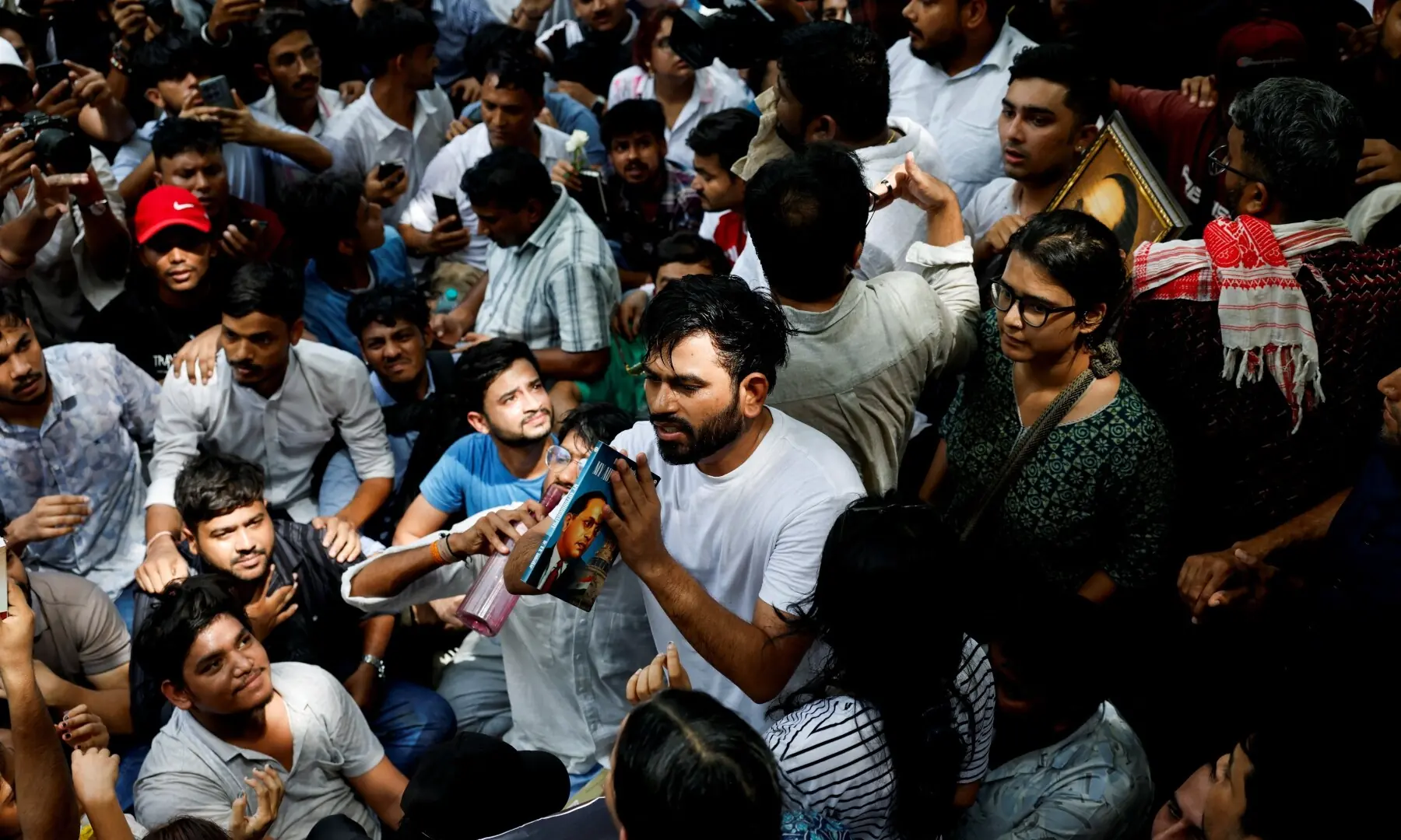 Abhijeet Dipke, head of the Cockroach Janta Party (CJP), requests supporters to maintain peace during a sit-in protest demanding the resignation of Indian Education Minister Dharmendra Pradhan, in New Delhi, India on June 6, 2026. —Reuters