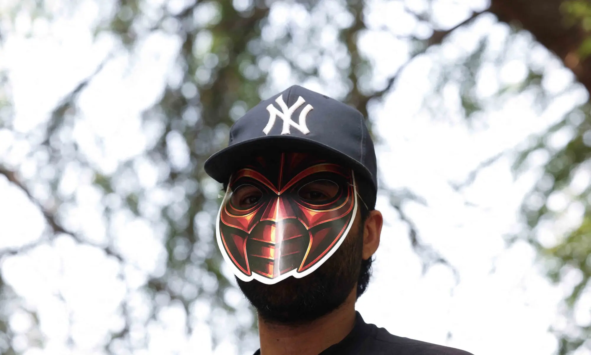 A person wears a cockroach themed mask, as supporters of the Cockroach Janta Party (CJP) await the arrival of Abhijeet Dipke, head of the CJP, on the day of a sit-in protest demanding the resignation of Indian Education Minister Dharmendra Pradhan, in New Delhi, India, June 6, 2026. — Reuters