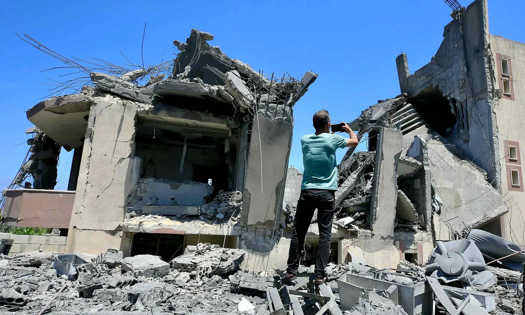 A man inspects damage following Israeli bombardment on a building in the village of Saksakiyeh in southern Lebanon on June 6, 2026. &mdash; AFP