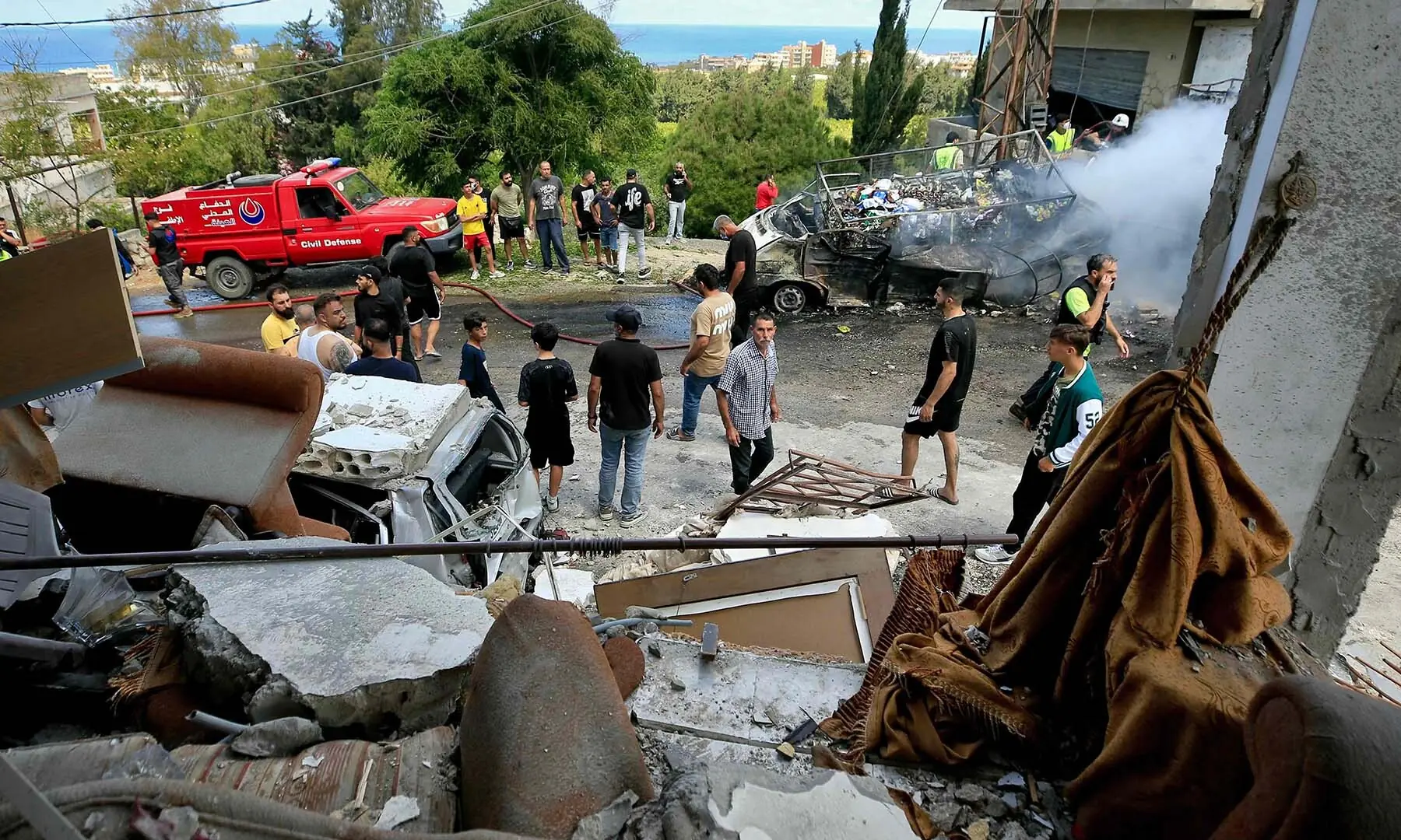 People inspect damage following Israeli bombardment on a building in the village of Saksakiyeh in southern Lebanon on June 6, 2026. &mdash; AFP