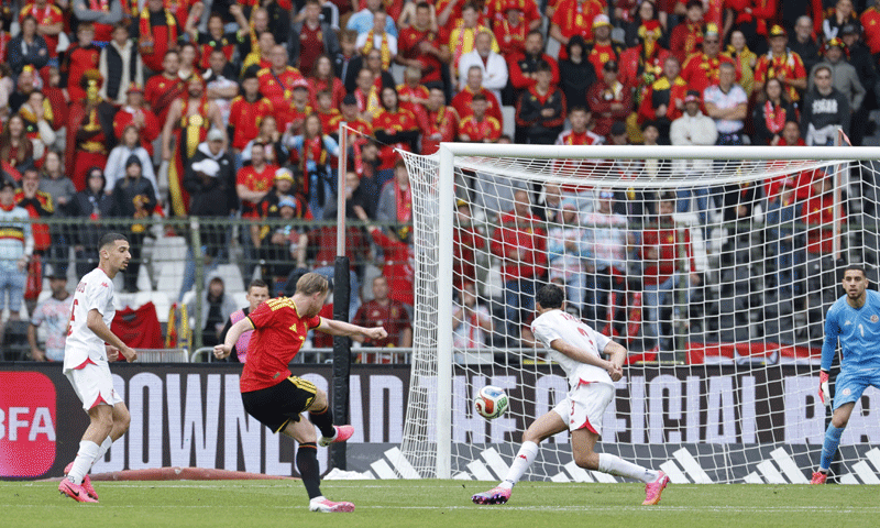 BRUSSELS: Belgium’s Kevin De Bruyne (second L) shoots to score against Tunisia during their international friendly at the King Baudouin Stadium on Saturday.—Reuters BRUSSELS: Belgium’s Kevin De Bruyne (second L) shoots to score against Tunisia during their international friendly at the King Baudouin Stadium on Saturday.—Reuters