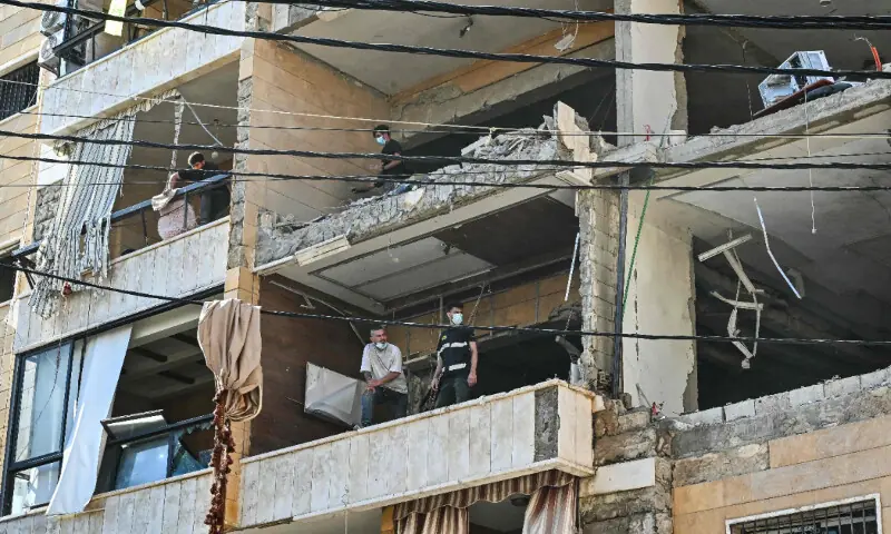  First responders inspect damage at the site of an Israeli airstrike targeting apartments in a residential building in Beirut&rsquo;s southern suburbs on June 7, 2026. &mdash; AFP 