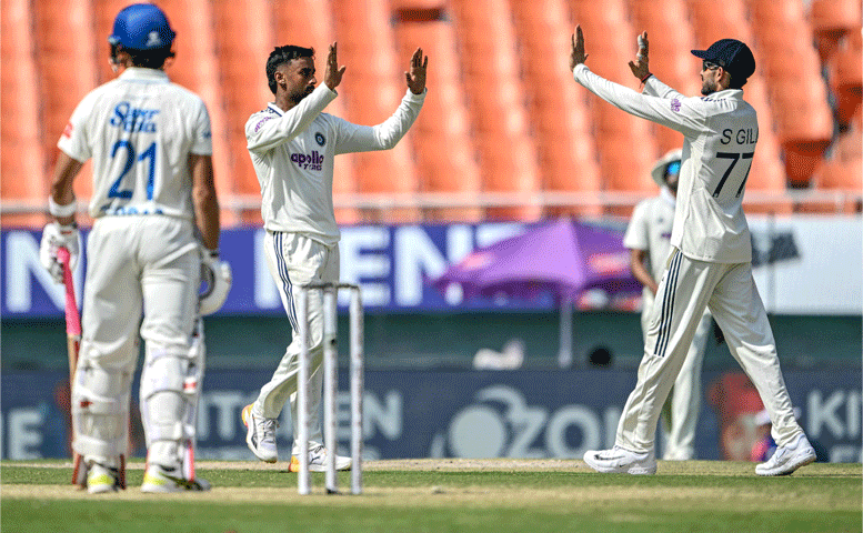 INDIAN spinner Manav Suthar (C) celebrates with captain Shubman Gill after dismissing Afghanistan batter Rahmanullah Gurbaz during the one-off Test at the Maharaja Yadavindra Singh International Cricket Stadium on Sunday.&mdash;AFP