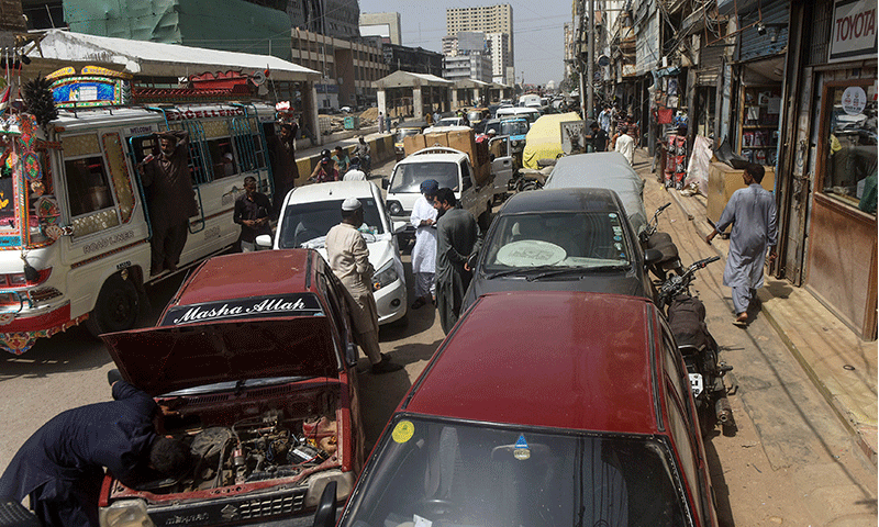 While work to extend the dedicated corridor of Green Line has already narrowed M.A. Jinnah Road, vehicles are forced to use a mere sliver of the key artery, thanks to roadside encroachments opposite Gul Plaza.—Fahim Siddiqi / White Star While work to extend the dedicated corridor of Green Line has already narrowed M.A. Jinnah Road, vehicles are forced to use a mere sliver of the key artery, thanks to roadside encroachments opposite Gul Plaza.—Fahim Siddiqi / White Star