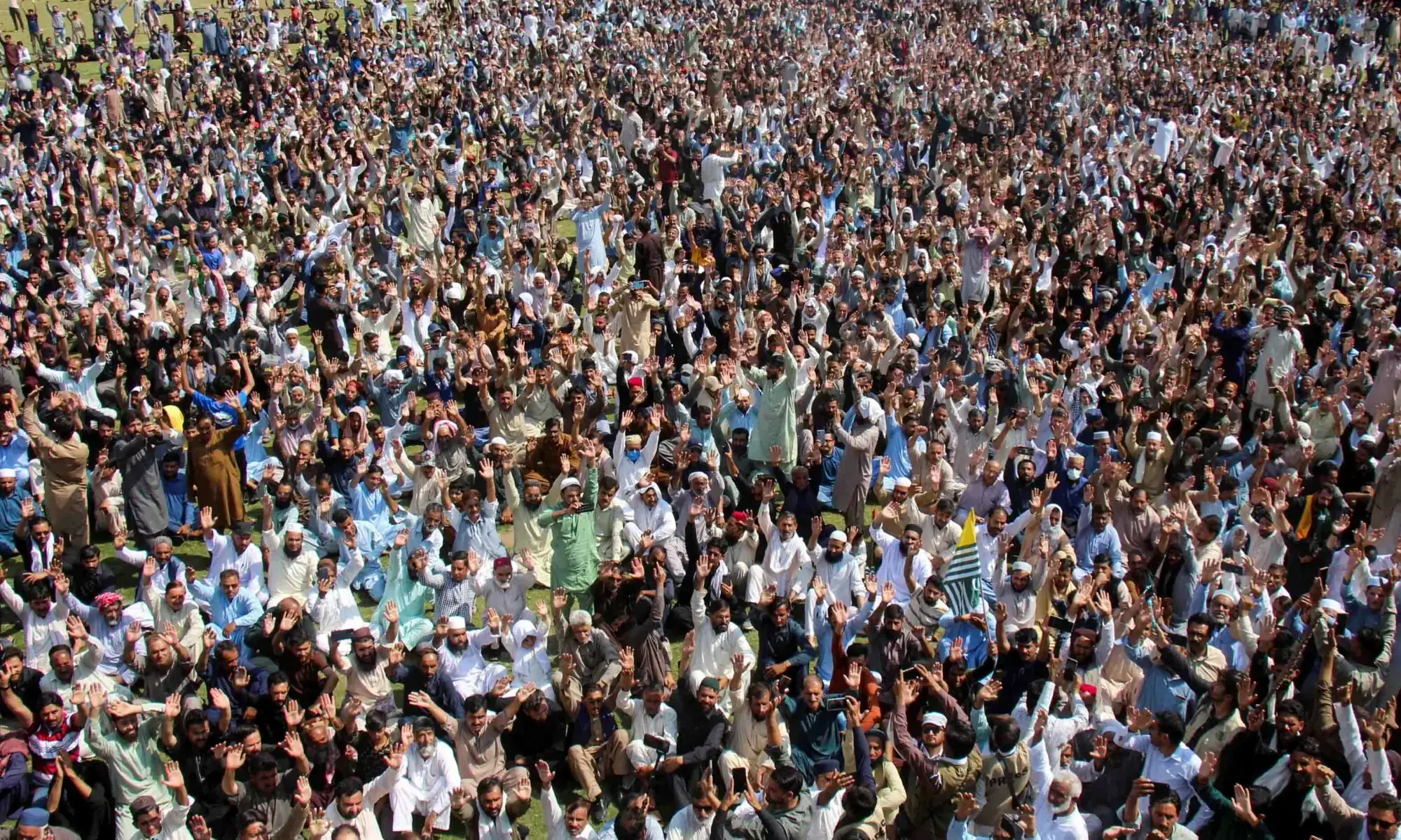 Supporters of the Joint Awami Action Committee (JAAC) chant slogans as they gather to attend the funeral of men who were killed during a protest following a shutter-down strike in Muzaffarabad on October 2. — Reuters Supporters of the Joint Awami Action Committee (JAAC) chant slogans as they gather to attend the funeral of men who were killed during a protest following a shutter-down strike in Muzaffarabad on October 2. — Reuters