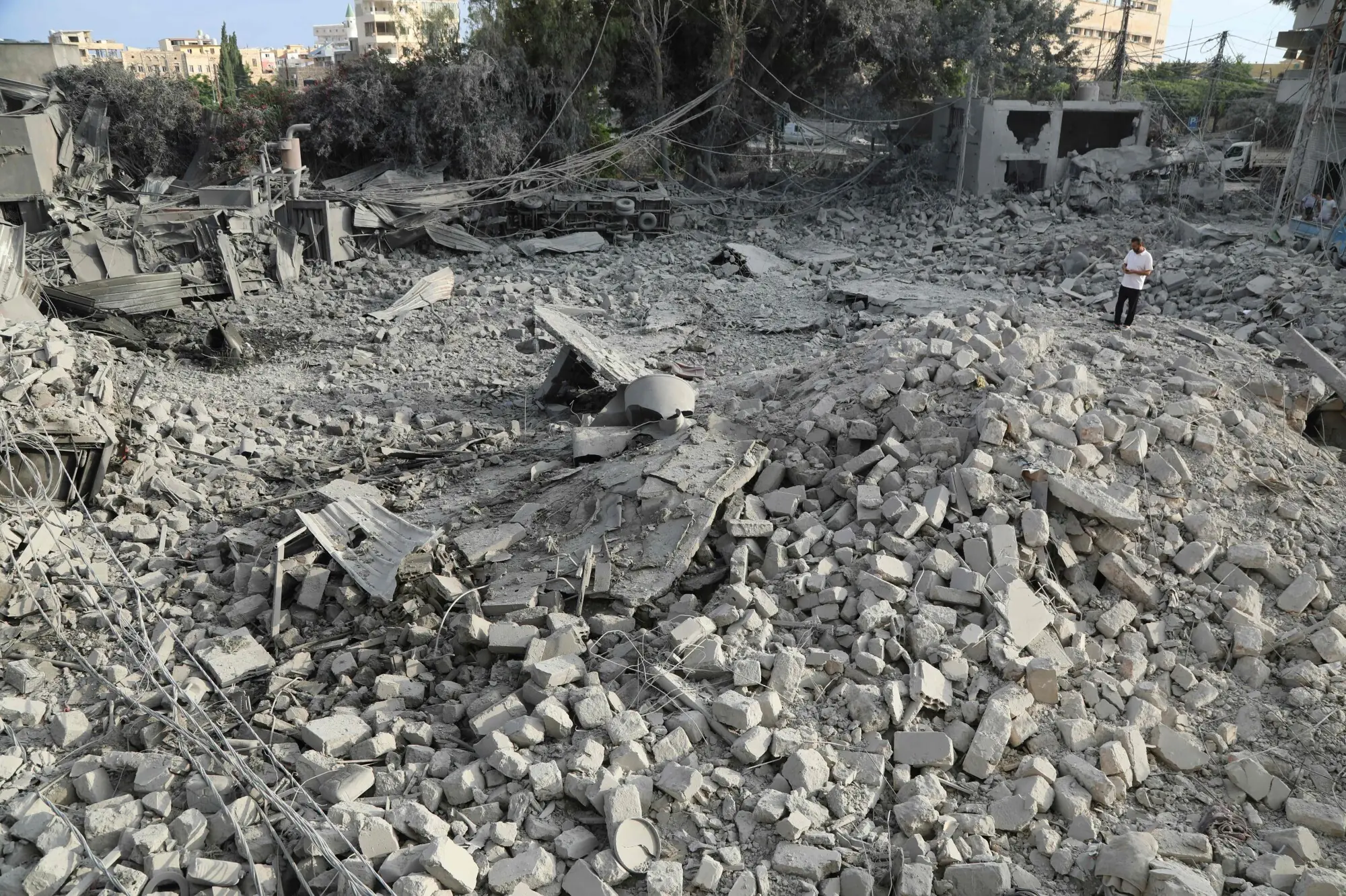 A man inspects the aftermath at the site of Israeli airstrikes that hit the previous day, near the archaeological site of the Roman hippodrome in the southern Lebanese city of Tyre on June 8, 2026. &mdash;AFP