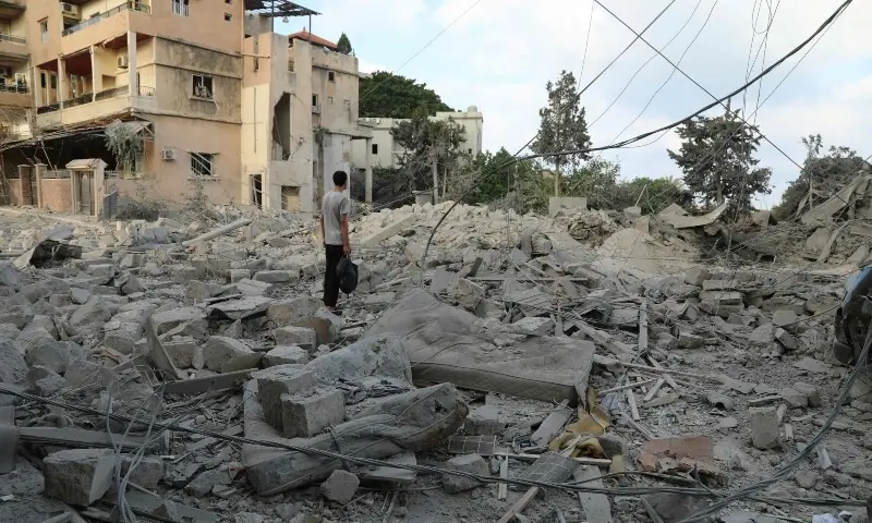 A man inspects the aftermath at the site of Israeli airstrikes that hit the previous day, near the archaeological site of the Roman hippodrome in the southern Lebanese city of Tyre on June 8, 2026. &mdash;AFP