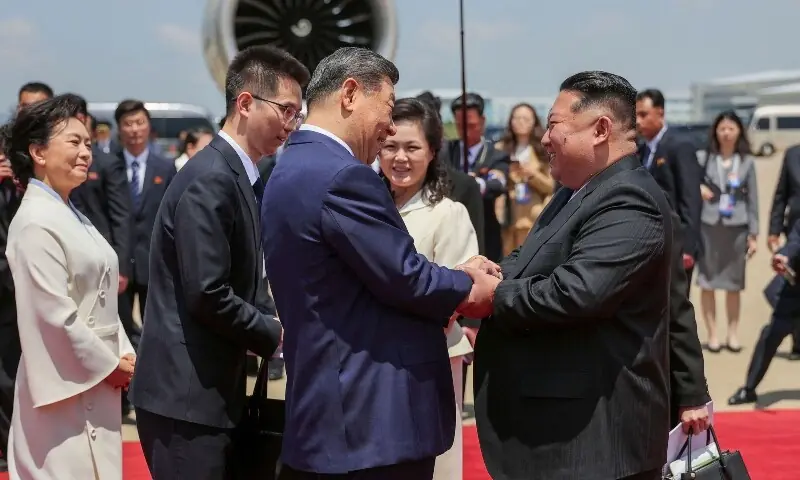 This picture taken on June 8, 2026 and released by North Korea's official Korean Central News Agency (KCNA) on June 9, 2026 shows North Korean leader Kim Jong Un (front R) greeting China's President Xi Jinping (front L) upon his arrival at Pyongyang Airport, North Korea. —KCNA via AFP This picture taken on June 8, 2026 and released by North Korea's official Korean Central News Agency (KCNA) on June 9, 2026 shows North Korean leader Kim Jong Un (front R) greeting China's President Xi Jinping (front L) upon his arrival at Pyongyang Airport, North Korea. —KCNA via AFP
