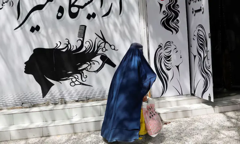 An Afghan woman walks past a beauty salon in Kabul, Afghanistan on July 6, 2023. — Reuters/File An Afghan woman walks past a beauty salon in Kabul, Afghanistan on July 6, 2023. — Reuters/File