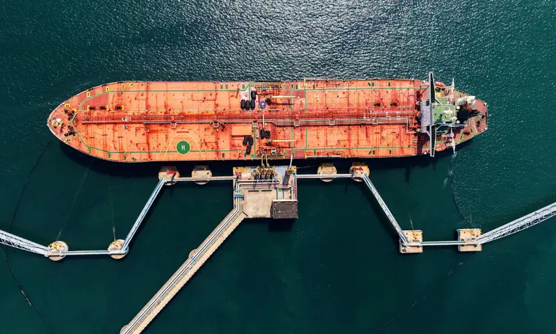 This aerial photo shows a tanker unloading imported crude oil at a terminal port in Qingdao, in China’s eastern Shandong province.—AFP This aerial photo shows a tanker unloading imported crude oil at a terminal port in Qingdao, in China’s eastern Shandong province.—AFP