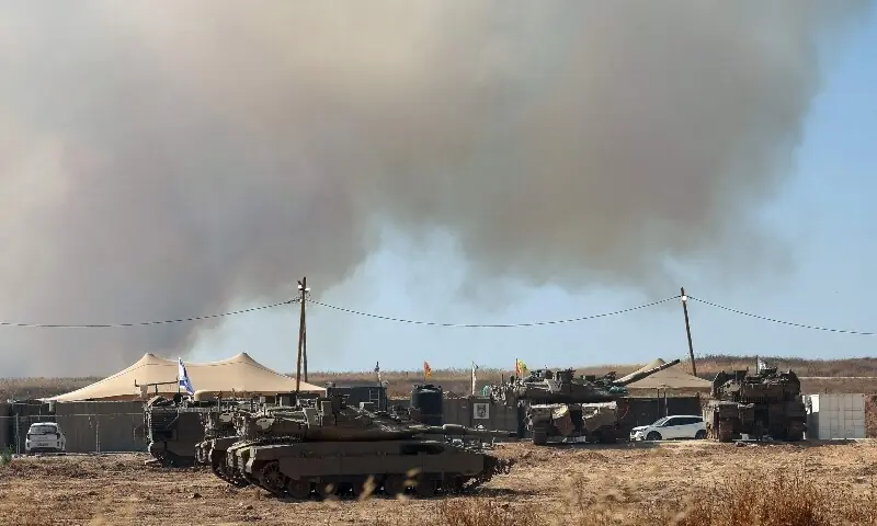 This picture taken from a position in southern Israel, on the border with the Gaza Strip, shows Israeli tanks and troops deployed by the border with the beseiged territory on June 10, 2026. — AFP This picture taken from a position in southern Israel, on the border with the Gaza Strip, shows Israeli tanks and troops deployed by the border with the beseiged territory on June 10, 2026. — AFP