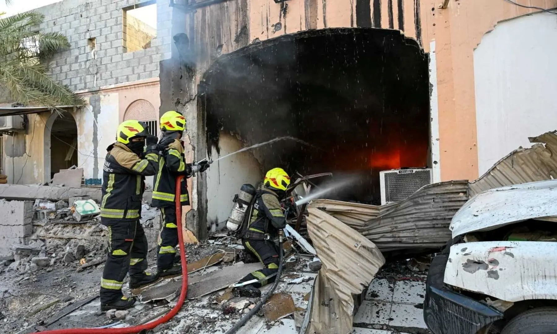 Firefighters work to extinguish fire in the aftermath of Iranian drone attacks, according to Bahrain&rsquo;s Interior Ministry, at a location given as Bahrain, in this handout image released on June 11, 2026. &mdash; Reuters
