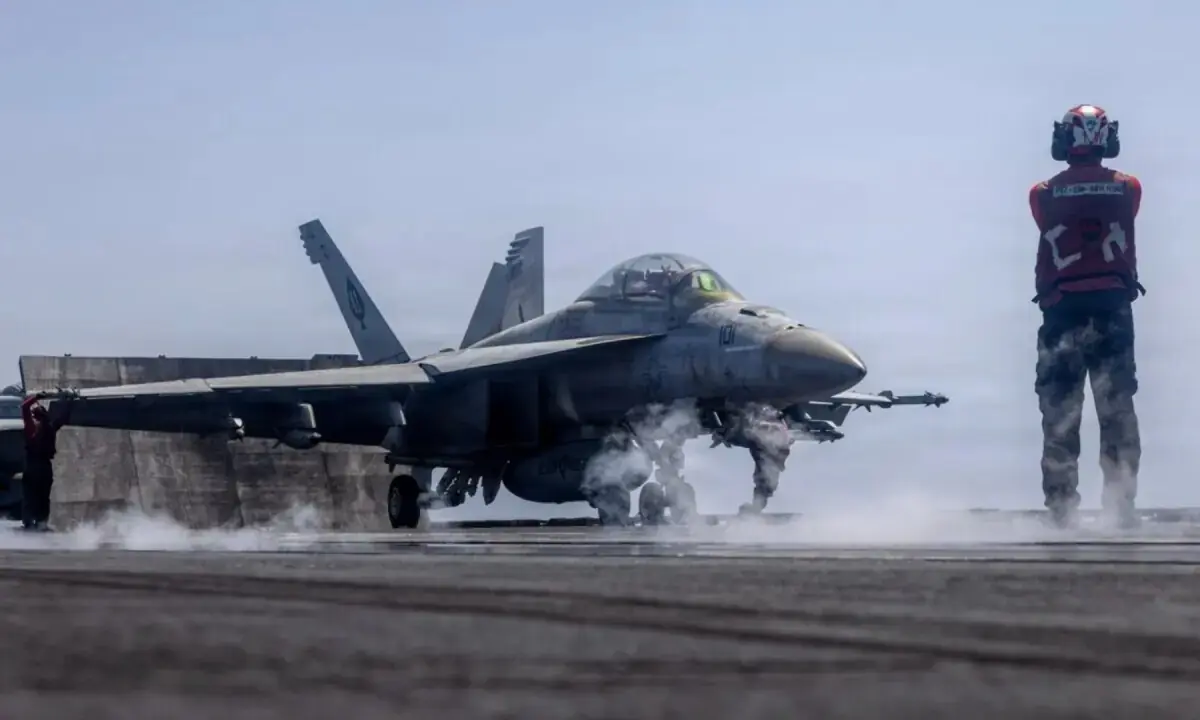 A US FA-18 fighter jet prepares for takeoff from an aircraft carrier in the Middle East, in this photo released on May 29, 2026. — X/@CENTCOM/File