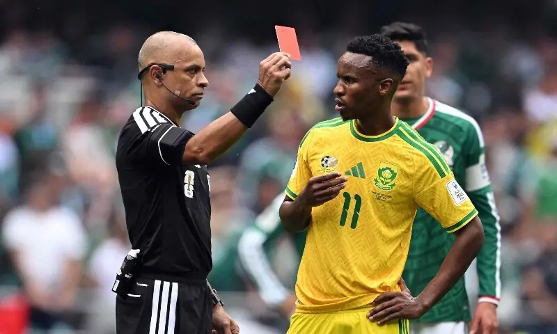 Brazilian referee Wilton Sampaio shows a red card to South African midfielder Themba Zwane during the 2026 World Cup Group A football match between Mexico and South Africa at the Estadio Azteca stadium in Mexico City on June 11, 2026. — AFP