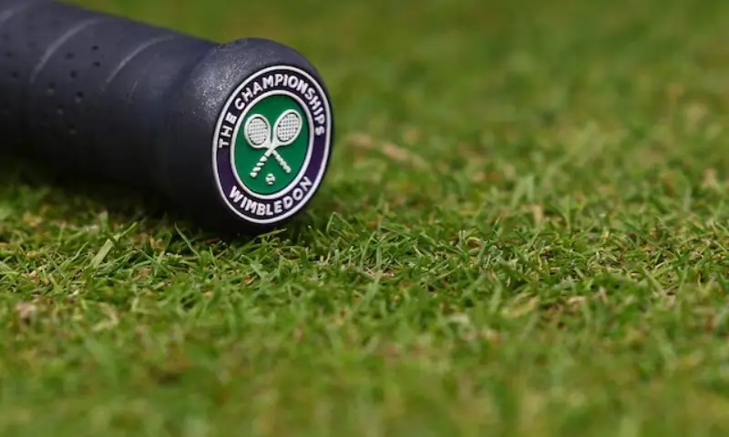 The Wimbledon logo is pictured on the handle of a racket. — Reuters/File The Wimbledon logo is pictured on the handle of a racket. — Reuters/File