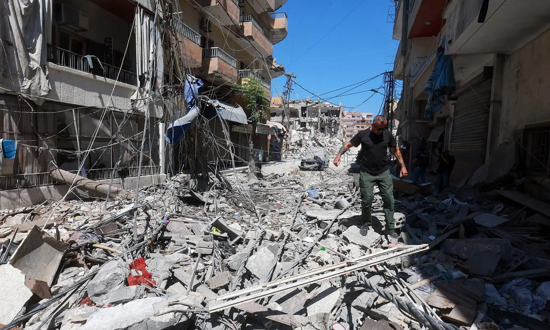 A man walks on rubble at the site an Israeli strike in Tyre, Lebanon on June 12, 2026. &mdash; Reuters
