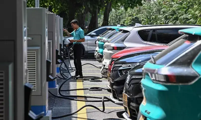 This picture taken on October 5, 2023 shows a driver charging a VinFast electric car at a charging station in Hanoi. —AFP/File This picture taken on October 5, 2023 shows a driver charging a VinFast electric car at a charging station in Hanoi. —AFP/File