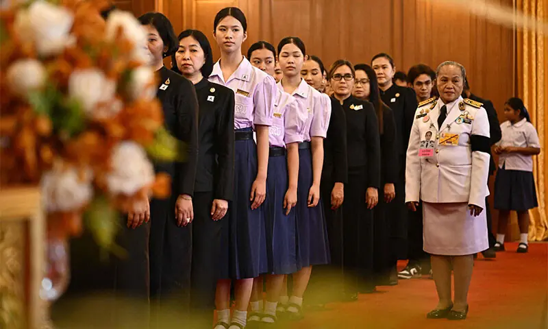 MOURNERS (in black) and government officials (in white) pay respects in front of a portrait of the late Princess Bajrakitiyabha Mahidol at the Grand Palace in Bangkok.—AFP MOURNERS (in black) and government officials (in white) pay respects in front of a portrait of the late Princess Bajrakitiyabha Mahidol at the Grand Palace in Bangkok.—AFP