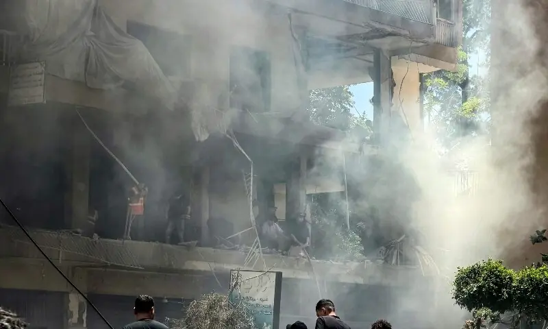 People look for survivors at the site of an Israeli airstrike that targeted a building in Beirut&rsquo;s southern suburbs on June 14. &mdash; AFP
