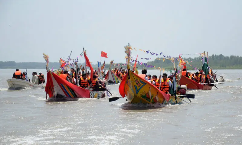 Dragon boat race under way in the Kabul River at Sardaryab, Charsadda, on Sunday. — White Star Dragon boat race under way in the Kabul River at Sardaryab, Charsadda, on Sunday. — White Star