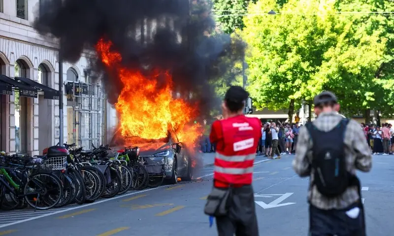 A Tesla car burns during a protest against the upcoming G7 summit in Evian-les-Bains in France, in Geneva, Switzerland, June 14, 2026. —Reuters A Tesla car burns during a protest against the upcoming G7 summit in Evian-les-Bains in France, in Geneva, Switzerland, June 14, 2026. —Reuters