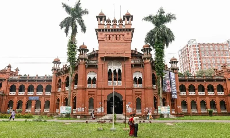 A couple takes a selfie in front of the Curzon Hall, a building of the British colonial period, now home to the Faculty of Sciences at Dhaka University. &mdash; Reuters