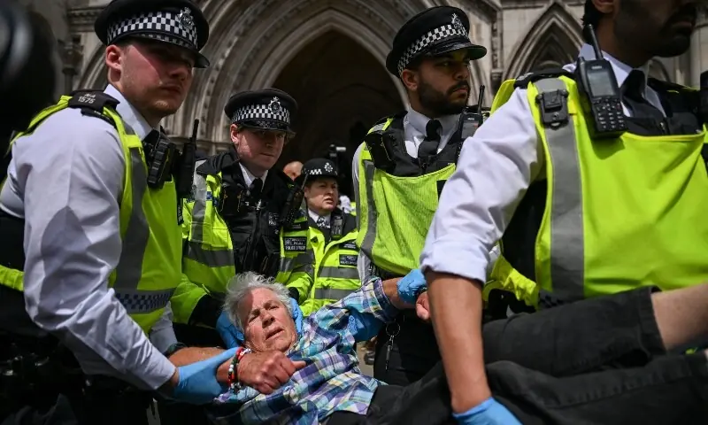 Police officers detain a demonstrator opposing the government's decision to ban Palestine Action as a terror organisation, following a Court of Appeal ruling on the lawfulness of proscribing the pro-Palestinian group under terrorism laws, outside the Royal Courts of Justice, in London, Britain on June 15, 2026. —Reuters Police officers detain a demonstrator opposing the government's decision to ban Palestine Action as a terror organisation, following a Court of Appeal ruling on the lawfulness of proscribing the pro-Palestinian group under terrorism laws, outside the Royal Courts of Justice, in London, Britain on June 15, 2026. —Reuters