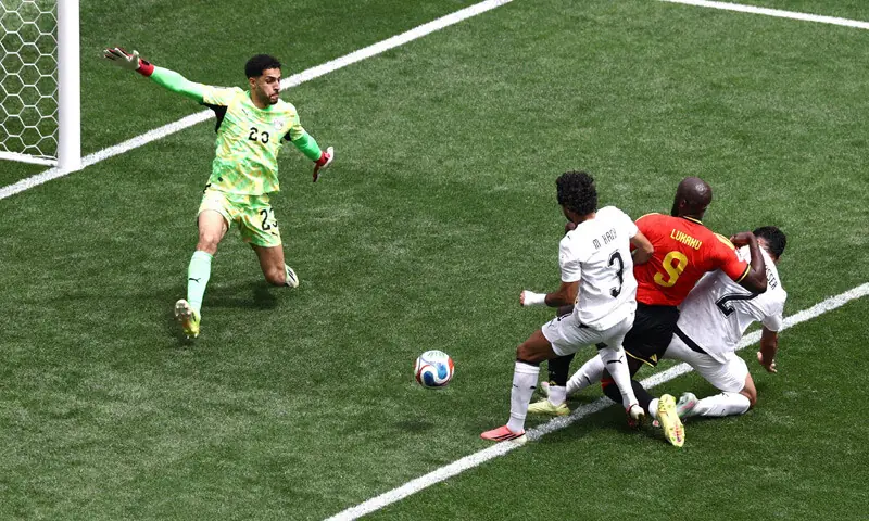 BELGIUM’s Romelu Lukaku (red kit) forces an own goal from Egypt’s Mohamed Hany.—Reuters BELGIUM’s Romelu Lukaku (red kit) forces an own goal from Egypt’s Mohamed Hany.—Reuters
