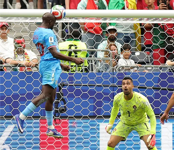 CONGO’S Yoane Wissa heads to score the equaliser during the Group ‘K’ match against Portugal at the Houston Stadium on Wednesday.—AFP CONGO’S Yoane Wissa heads to score the equaliser during the Group ‘K’ match against Portugal at the Houston Stadium on Wednesday.—AFP