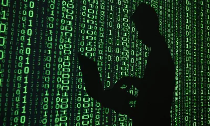 The file photo shows a man's silhouette with a laptop. — AFP/File The file photo shows a man's silhouette with a laptop. — AFP/File