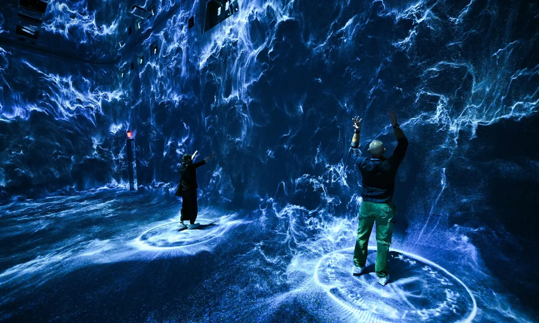 Attendees interact with immersive visualisations from the inaugural exhibition Machine Dreams: Rainforest are projected at Dataland, the Museum of AI Arts, in Los Angeles, California on June 9, 2026. — AFP