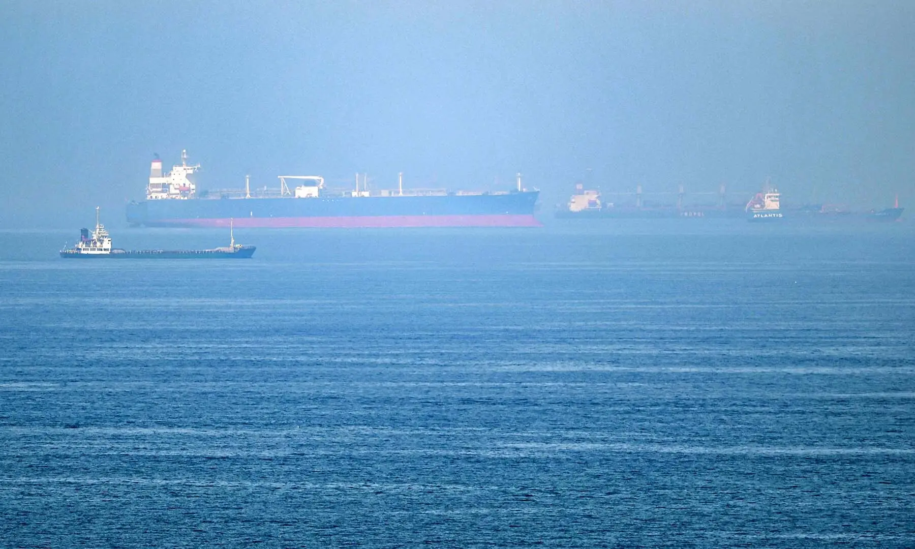 Cargo ships are pictured off cost of the Khor Fakkan Container Terminal, the only natural deep-sea port in the region and one of the major container ports in Sharjah Emirate, along the Gulf of Oman on June 19, 2026. &mdash; AFP