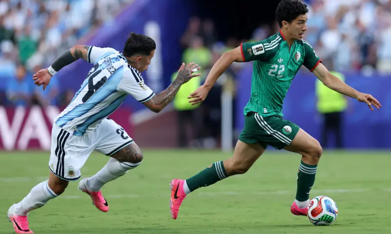 Algeria's Ibrahim Maza (R) is tracked by Argnbtina's Enzo Fernandes during the 2026 FIFA World Cup Group 'J' match at the Kansas City Stadium in Kansas City, Missouri on June 16, 2026.--AFP