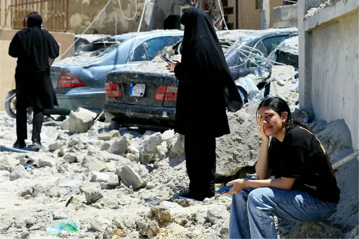 A woman weeps as she sits on the rubble at the site of an Israeli air strike that targeted the village of Qennarit, in southern Lebanon.—AFP A woman weeps as she sits on the rubble at the site of an Israeli air strike that targeted the village of Qennarit, in southern Lebanon.—AFP