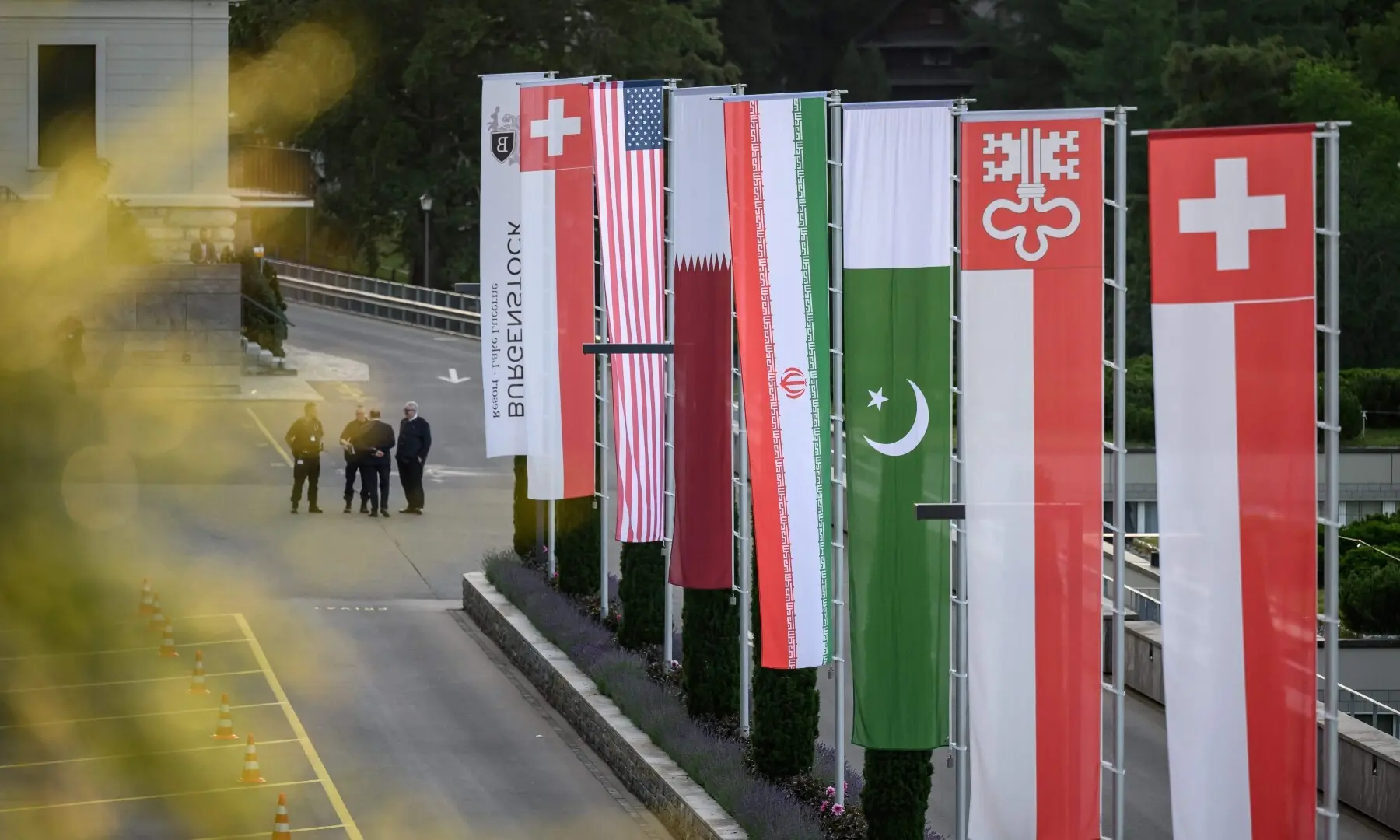 Flags of Switzerland, United States, Qatar, Pakistan and local Swiss canton of Nidwalden are photographed at the Burgenstock luxury hotel complex overlooking Lake Lucerne, Switzerland, on June 21. — AFP