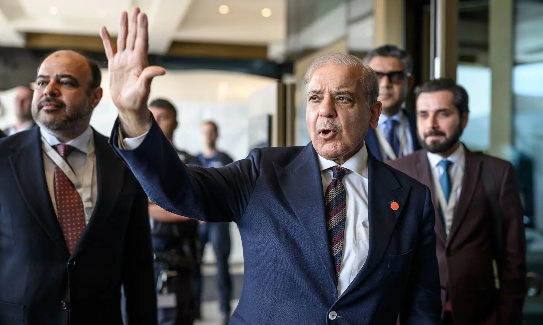 Prime Minister Shehbaz Sharif gestures upon his arrival at the Burgenstock luxury hotel complex overlooking Lake Lucerne, Switzerland, on June 21. &mdash; AFP