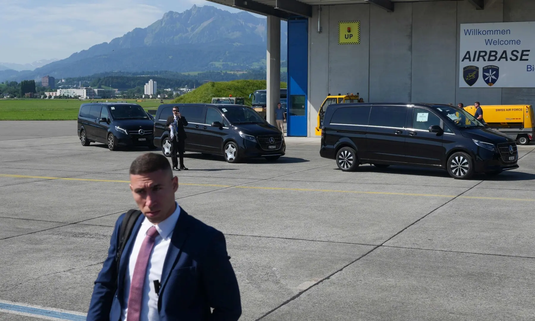 Members of US Vice President JD Vance’s staff arrive for high-level talks aimed at advancing a deal to end the Middle East conflict, at Emmen Military Air Base, in Emmen, Switzerland, on June 21. — AFP