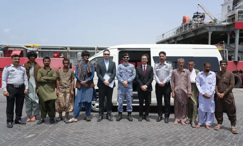 PMSA workers stand for a photo with eight Iranian nationals who were rescued at sea by the MMA Valour, on June 21. — via PMSA PMSA workers stand for a photo with eight Iranian nationals who were rescued at sea by the MMA Valour, on June 21. — via PMSA