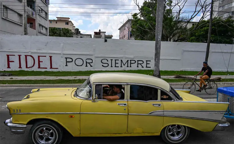 An old car drives past a wall reading “Fidel forever”, referring to late Cuba’s President Fidel Castro in Havana on June 19, 2026. Nearly 70 years after Fidel Castro’s 1959 revolution, communist-run Cuba has adopted a sweeping package of free-market reforms aimed at extricating the country from a deep crisis.—AFP An old car drives past a wall reading “Fidel forever”, referring to late Cuba’s President Fidel Castro in Havana on June 19, 2026. Nearly 70 years after Fidel Castro’s 1959 revolution, communist-run Cuba has adopted a sweeping package of free-market reforms aimed at extricating the country from a deep crisis.—AFP