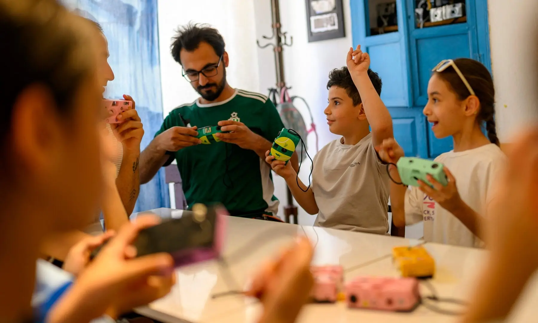 Children choose film cameras at a workshop held as part of Fotohane Darkroom project in Mardin, southeastern Turkiye, on June 13, 2026. — AFP