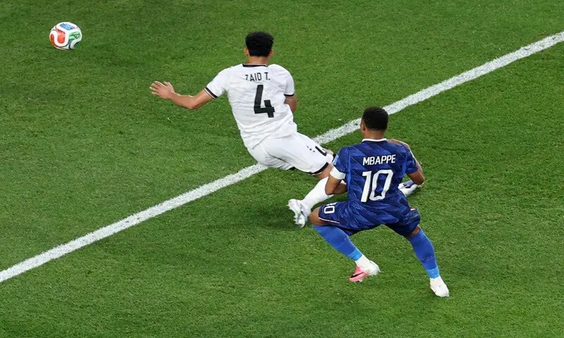 France's Kylian Mbappe (R) shoots to score against Iraq during their 2026 World Cup Group 'I' match at the Philadelphia Stadium in Philadelphia on June 23, 2026. &mdash;AFP
