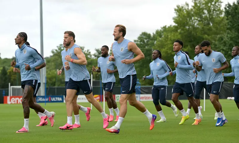 KANSAS CITY (Missouri): England players jog during a training session at Swope Soccer Village.—AFP KANSAS CITY (Missouri): England players jog during a training session at Swope Soccer Village.—AFP