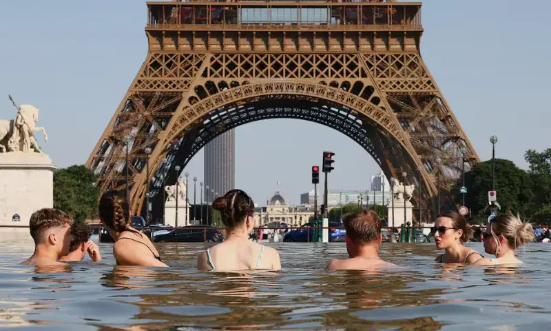 People cool off in the Trocadero Fountain next to the Eiffel Tower as temperatures rise during a heatwave affecting a large part of the country, in Paris, France, June 22.— Reuters People cool off in the Trocadero Fountain next to the Eiffel Tower as temperatures rise during a heatwave affecting a large part of the country, in Paris, France, June 22.— Reuters
