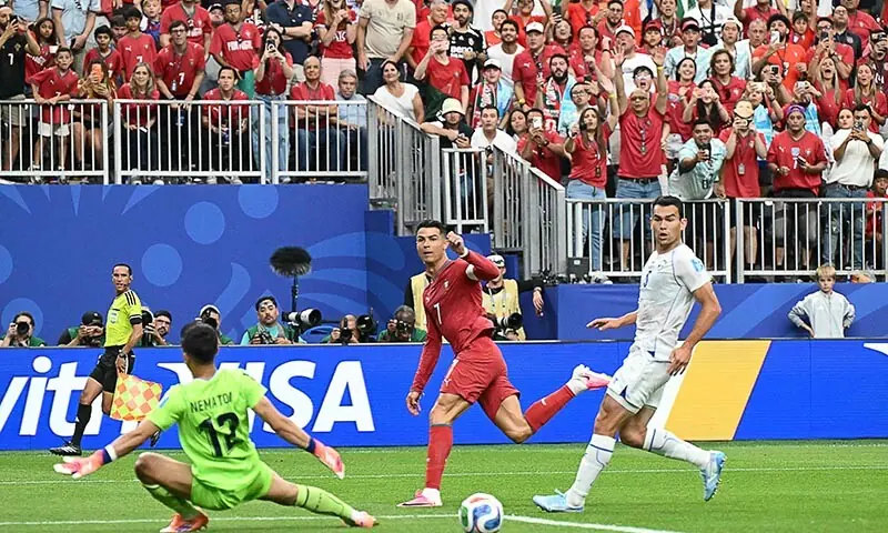 Portugal’s Cristiano Ronaldo (C) reacts as he scores his team’s third goal during the 2026 World Cup Group K football match between Portugal and Uzbekistan at the Houston Stadium in Houston on June 23, 2026. — AFP
