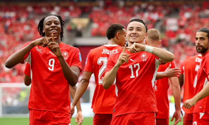 Ruben Vargas (right) of Switzerland celebrates with teammate Johan Manzambi after scoring his team&rsquo;s first goal against Canada.&mdash;AFP