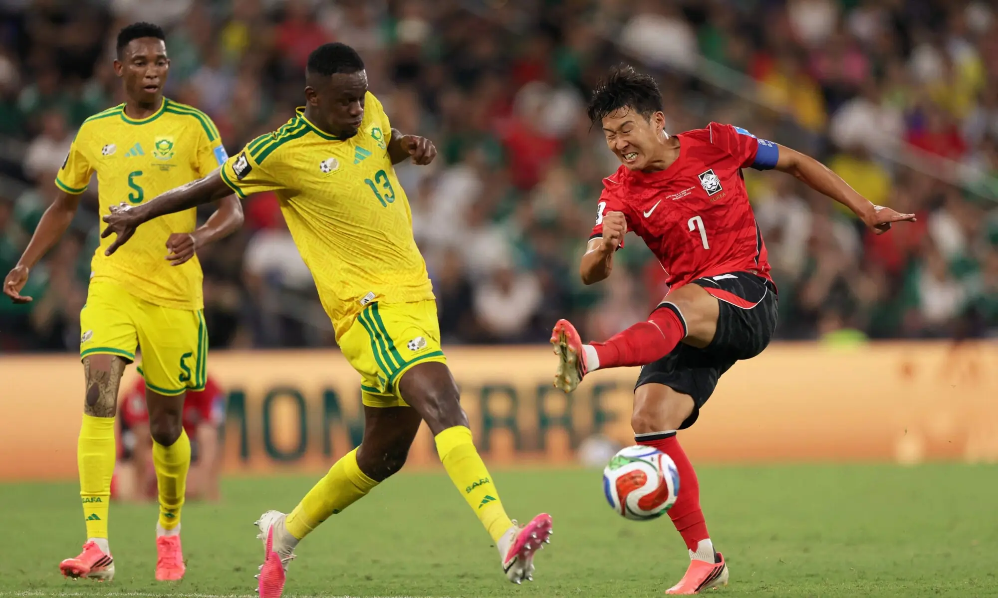 South Korea's forward #07 Son Heung-min misses to kick the ball as he's defended by South Africa's midfielder #13 Sphephelo Sithole during the 2026 World Cup Group A football match between South Africa and South Korea at the Monterrey Stadium in Guadalupe, Mexico, on June 24, 2026. &mdash; AFP